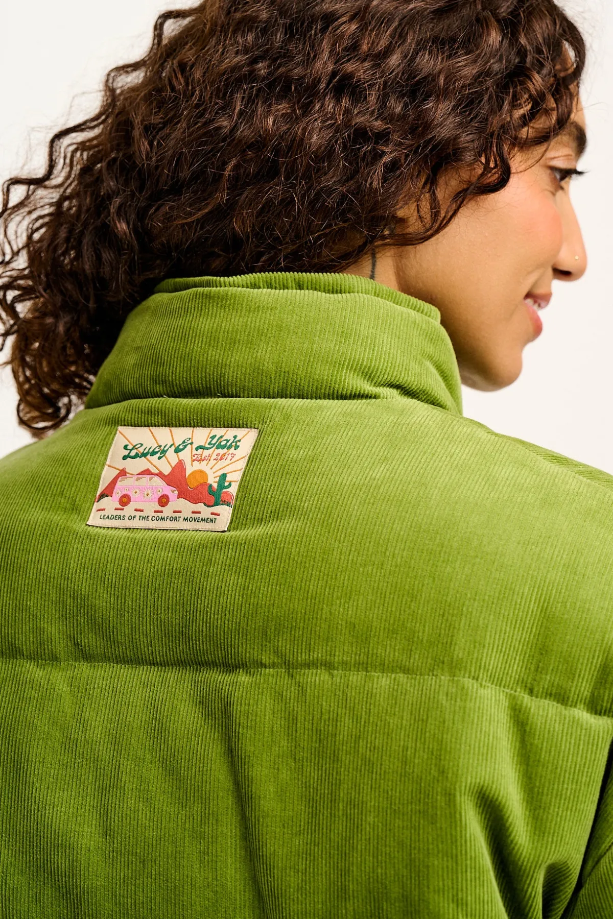 paloma__corduroy_puffer_jacket_in_leaf_green_6.webp Lucy & Yak Paloma - Corduroy Puffer Jacket in Leaf Green